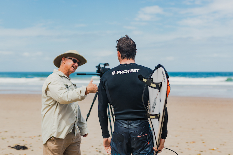 Martin Dunn coaching professional surfer Tristan Guilbaud at Old Bar Beach in Australia