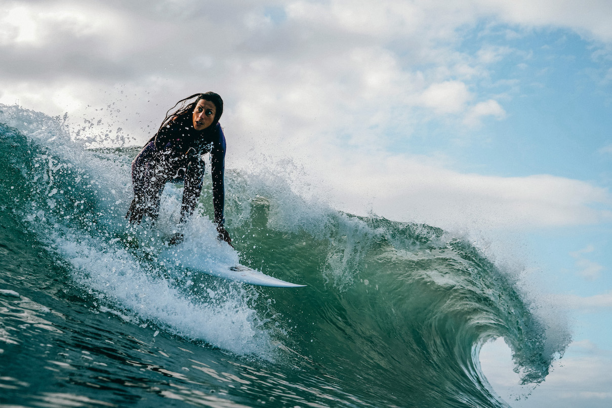Sonia Houria taking off on a wave.